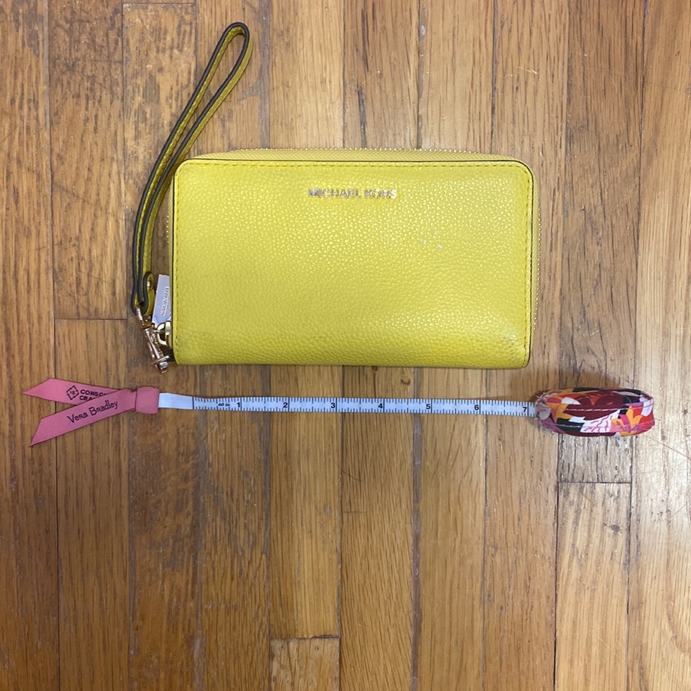 As is yellow Michael Kors wristlet